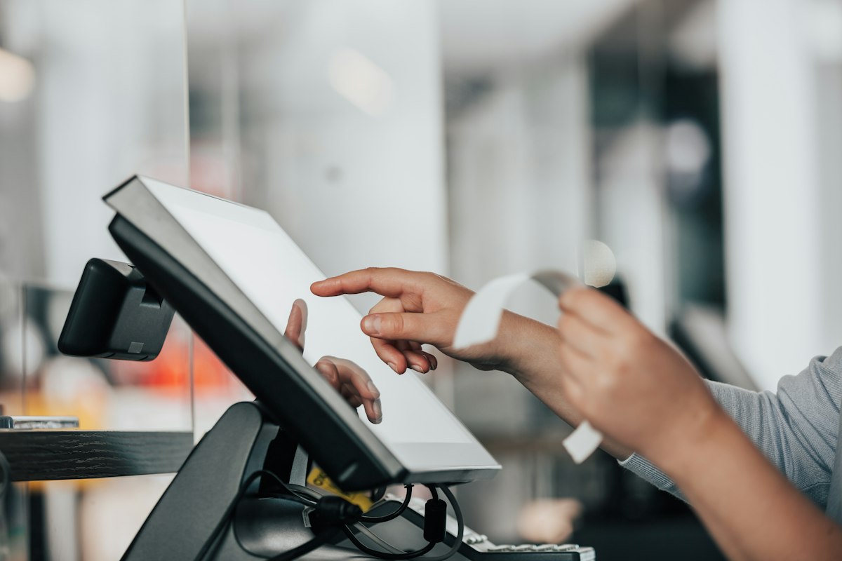 Customer paying at a restaurant counter